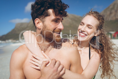 Couple enjoying standing at beach