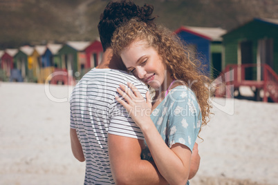 Happy couple relaxing at beach on a sunny day