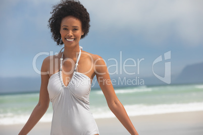 Woman standing at beach on a sunny day