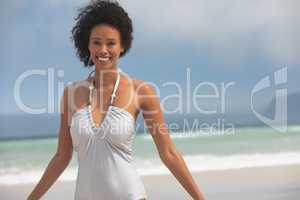 Woman standing at beach on a sunny day