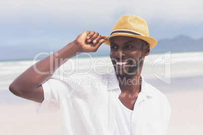 Man standing at beach on a sunny day