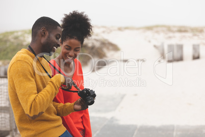 Couple using digital camera