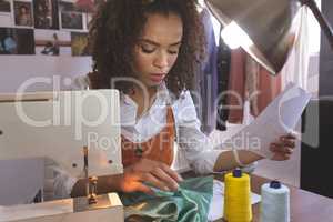 Female fashion designer working in design studio