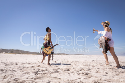 Young women having fun at beach in the sunshine