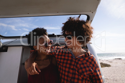 Couple interacting with each other at beach