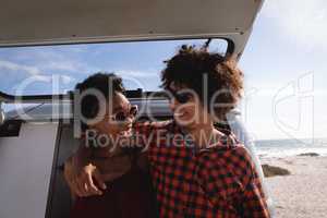 Couple interacting with each other at beach