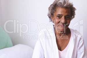 Happy senior woman smiling while sitting at nursing home