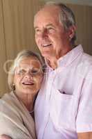Senior couple posing while standing  at retirement home