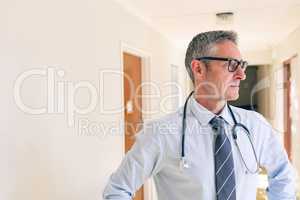 Male  doctor standing in corridor at retirement home