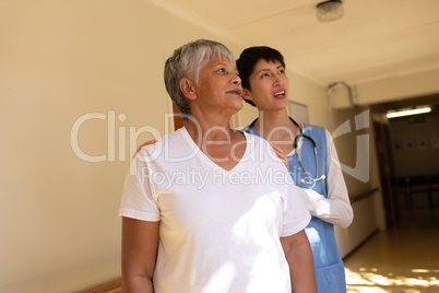 Senior female patient and female nurse standing