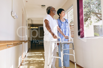 Female nurse and senior male patient interacting