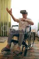 Senior male patient using virtual reality headset at retirement home