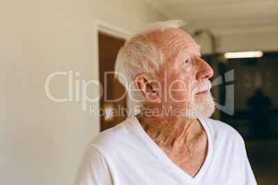 Senior male patient standing at retirement home