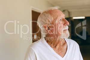 Senior male patient standing at retirement home