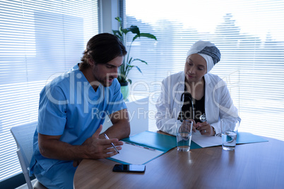 Surgeons interacting with each other in clinic