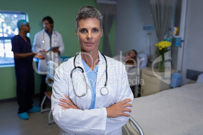 Matured female doctor standing in clinic at hospital
