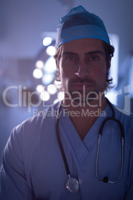 Male surgeon standing in operation room at hospital