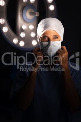 Female surgeon standing at operation room