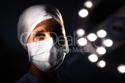 Female surgeon standing at operation room