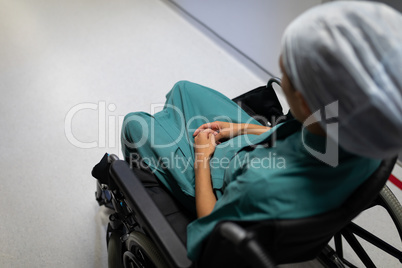 Female patient sitting on wheelchair