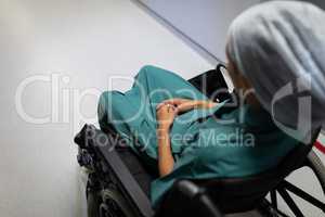 Female patient sitting on wheelchair