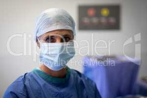 Female surgeon standing at operation room