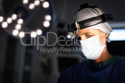 Mature female surgeon operating in operation theater