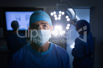 Male surgeon standing at operation theater