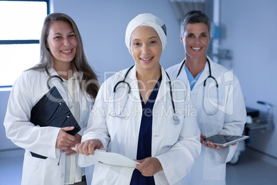 Matured female doctors standing in hospital floor