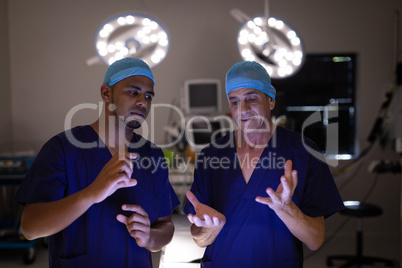 Surgeons interacting with each other in operation theater