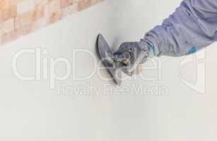 Worker Smoothing Wet Pool Plaster With Trowel