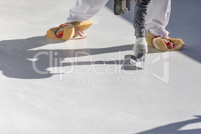 Worker Wearing Sponges On Shoes Smoothing Wet Pool Plaster