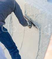 Worker Smoothing Wet Pool Plaster With Trowel