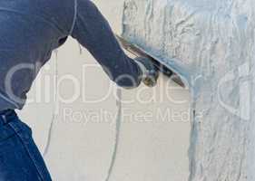 Worker Smoothing Wet Pool Plaster With Trowel