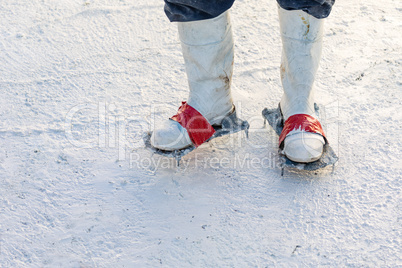 Worker Wearing Spiked Shoes Standing in Wet Plaster Pool