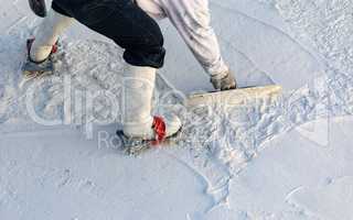 Worker Wearing Spiked Shoes Smoothing Wet Pool Plaster With Trowel