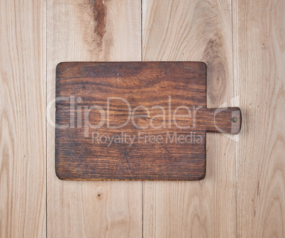 empty old kitchen cutting board on a wooden table