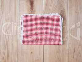 red textile towel in a white cell