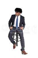 Young good looking black man sitting on chair