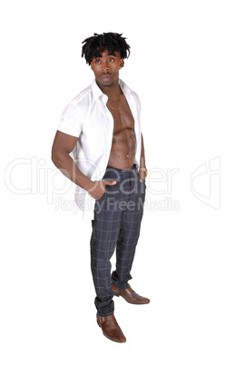 Black man standing in the studio with open shirt