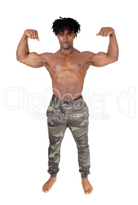 African man standing and flexing his muscles