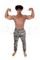 African man standing and flexing his muscles
