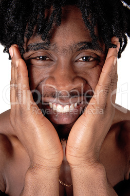 Close up image of a black man with his hands on the face