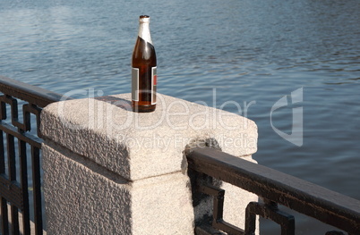 bottle on fence