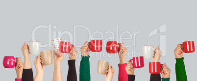 many raised hands up with ceramic cups on a white background