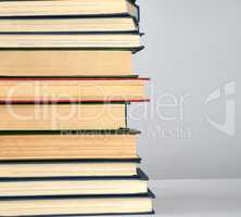stack of different books on a gray background
