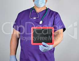 doctor in uniform and latex sterile gloves holding a blank black