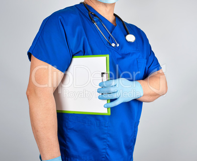 doctor in blue uniform and sterile latex gloves holds clipboard