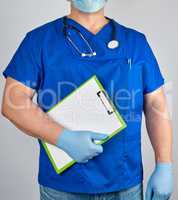 doctor in blue uniform and sterile latex gloves holds clipboard