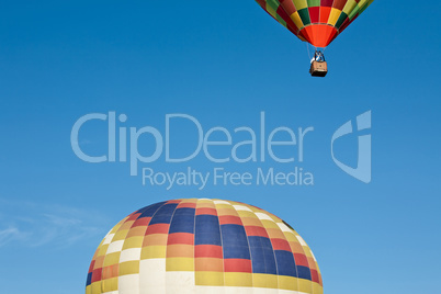 Colorful hot-air balloon ready to get up in flight and another a